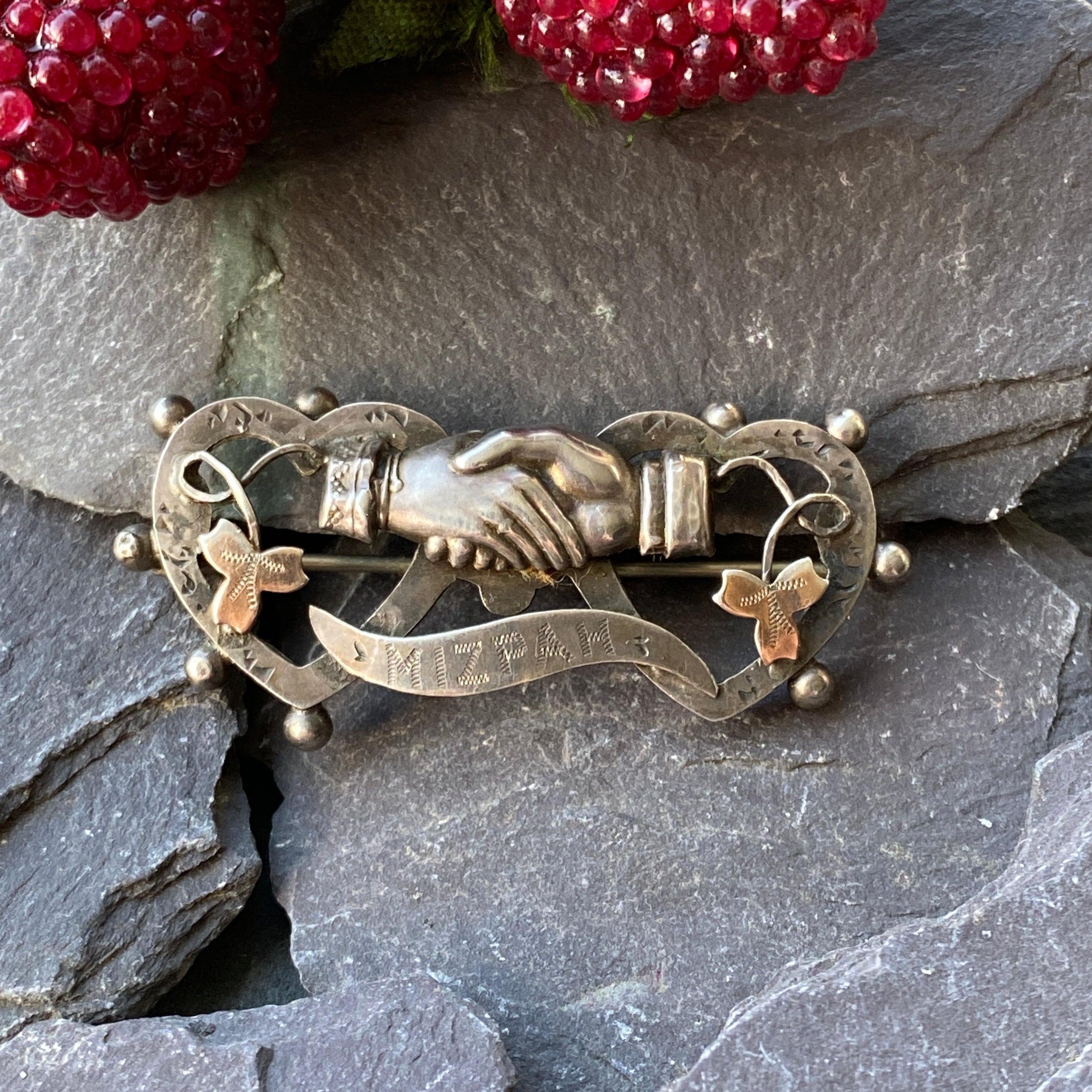 Victorian brooch of clasped hands with Mizpah engraving