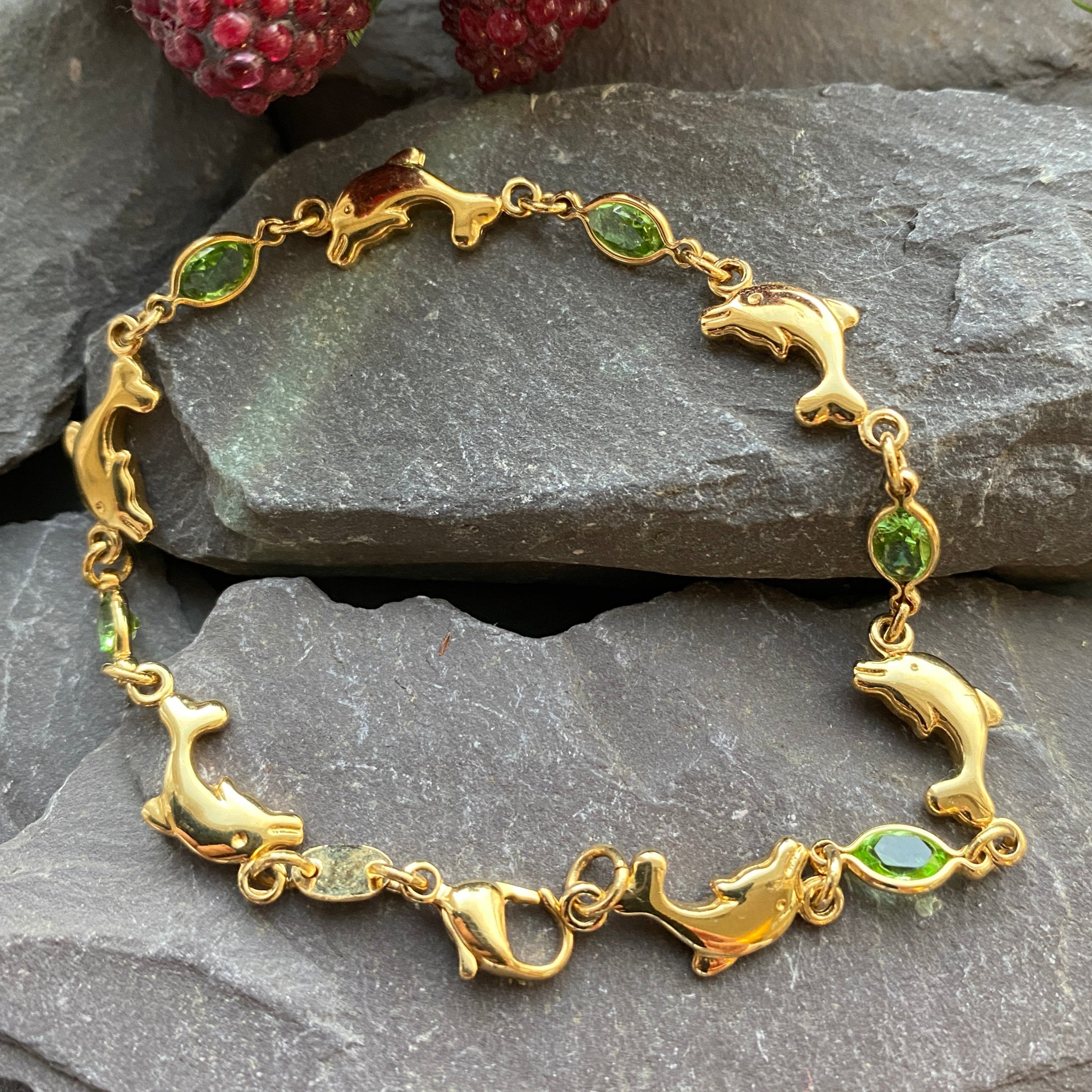 Dolphin Bracelet With Green Gem Detail.