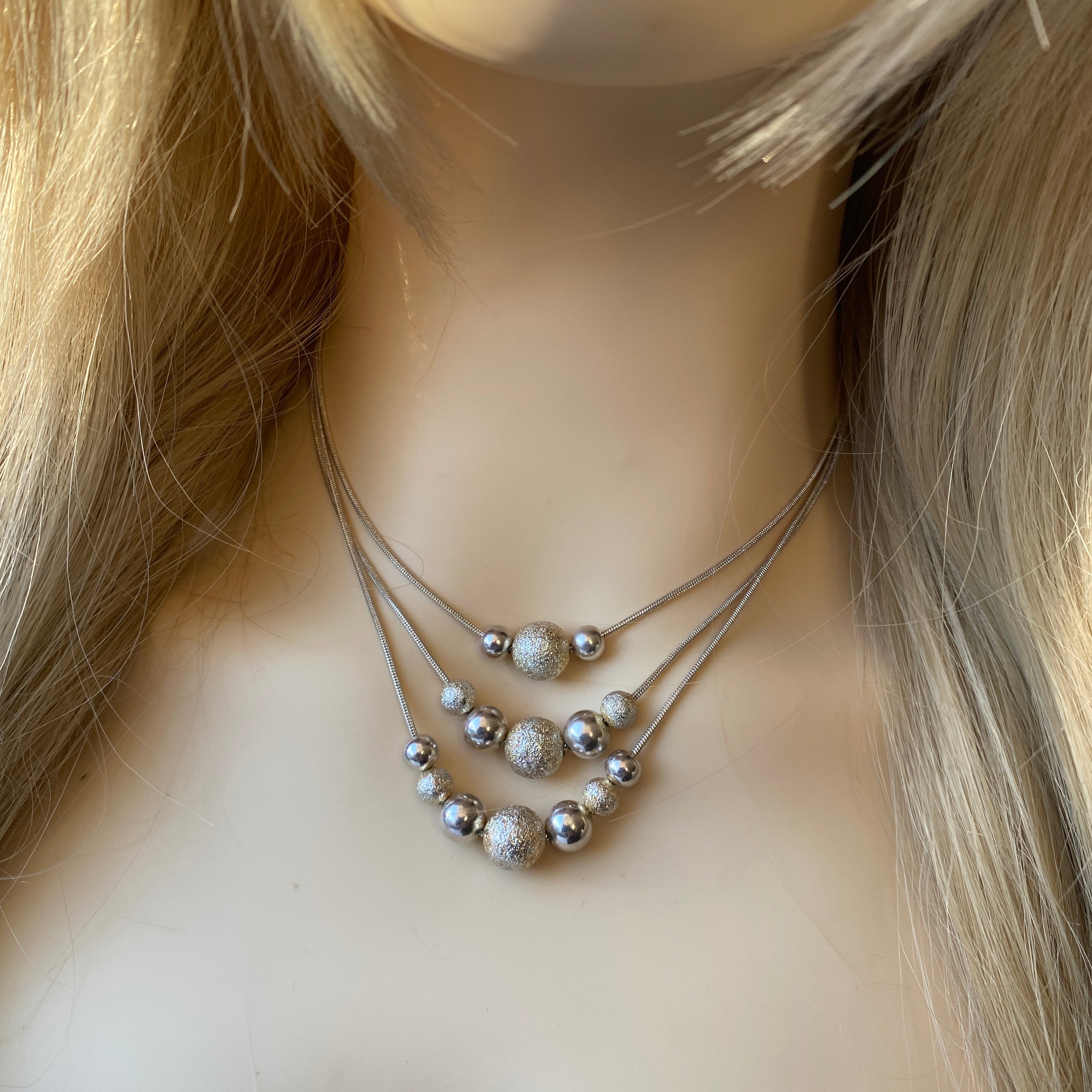 Silver Three Strand Silver Bead Necklace.