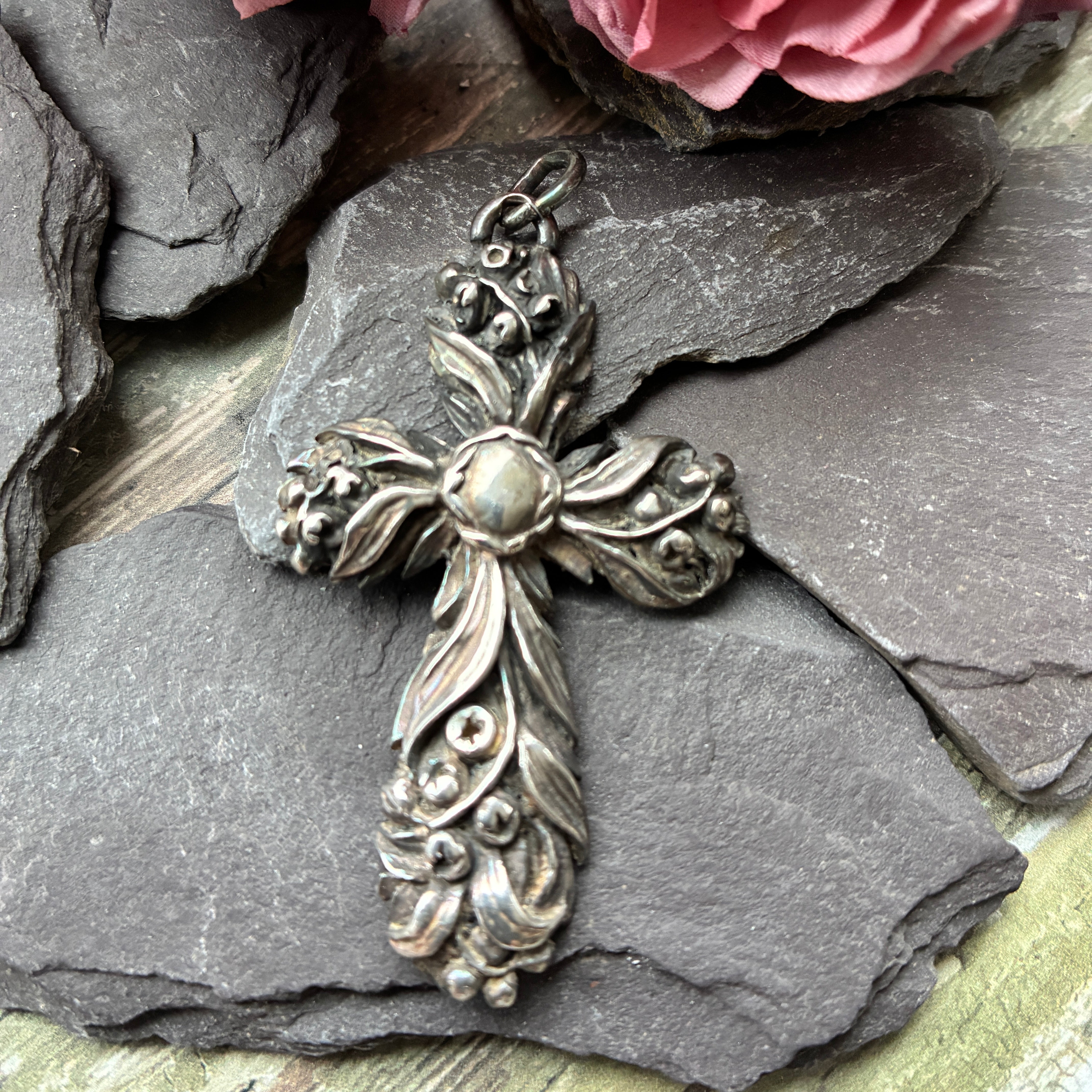 Vintage sterling silver embossed cross with foliate and floral detail