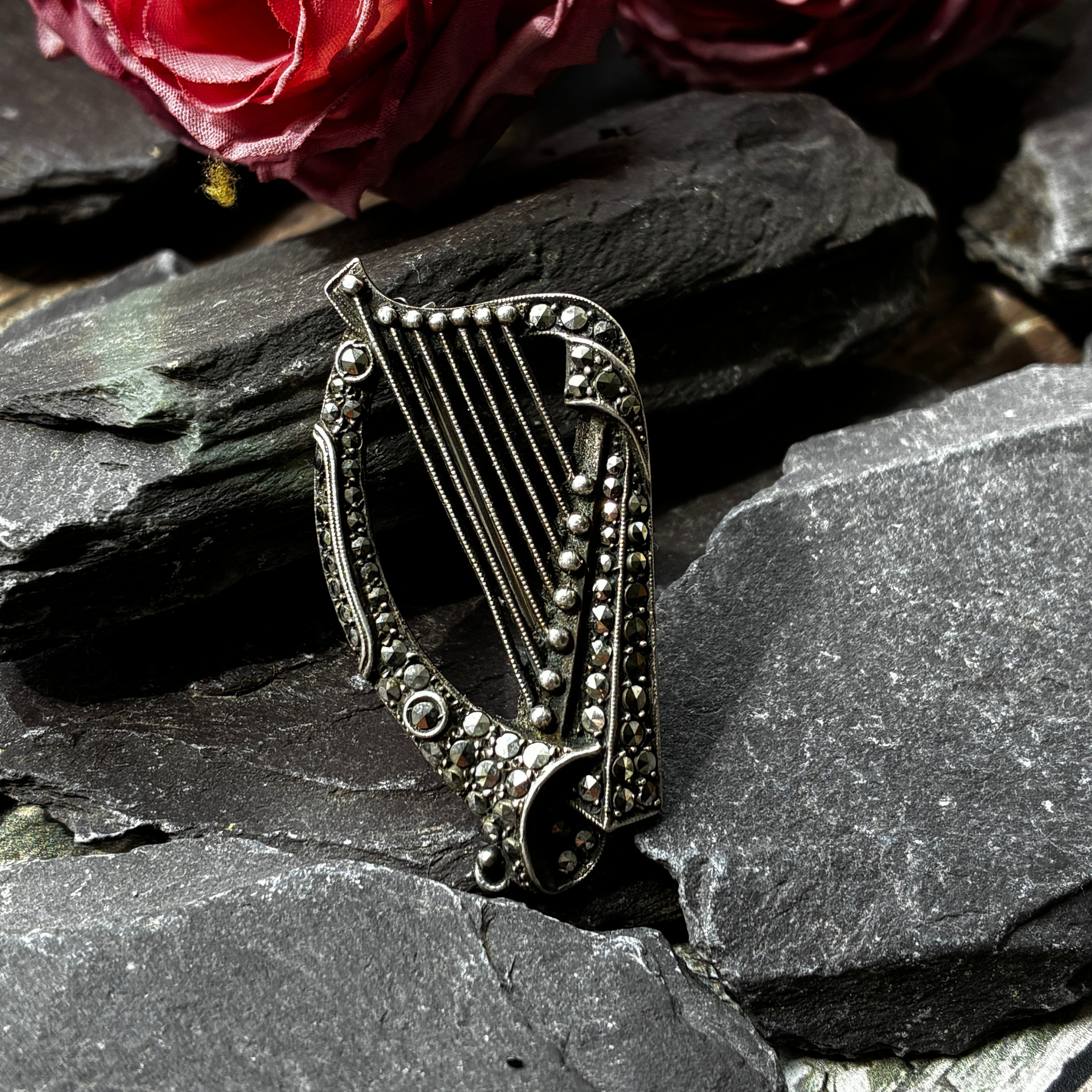 Vintage silver and marcasite harp shaped brooch.