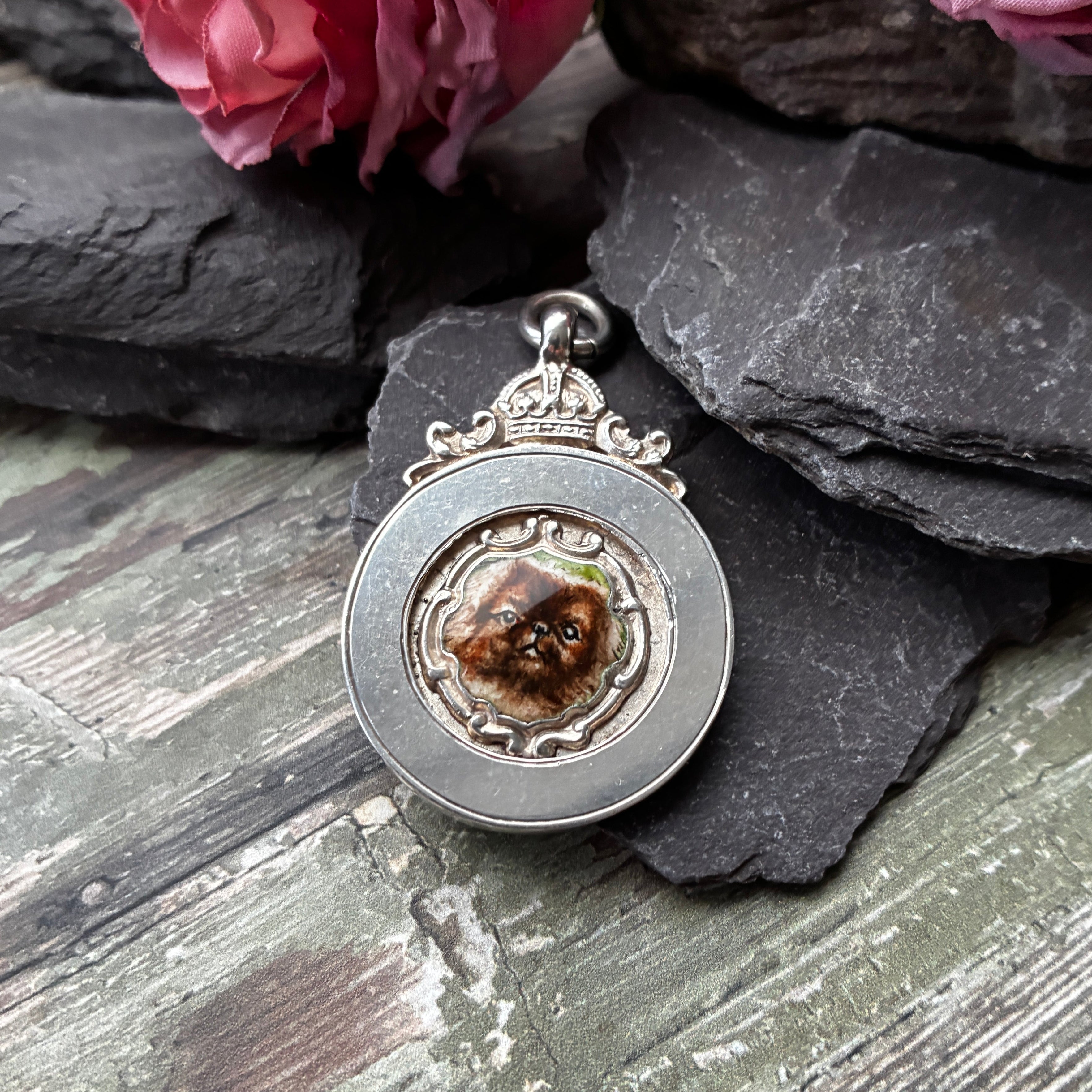 Early 20th century sterling silver Albert fob pendant with hand painted enamel plaque of a Pekinese dog.