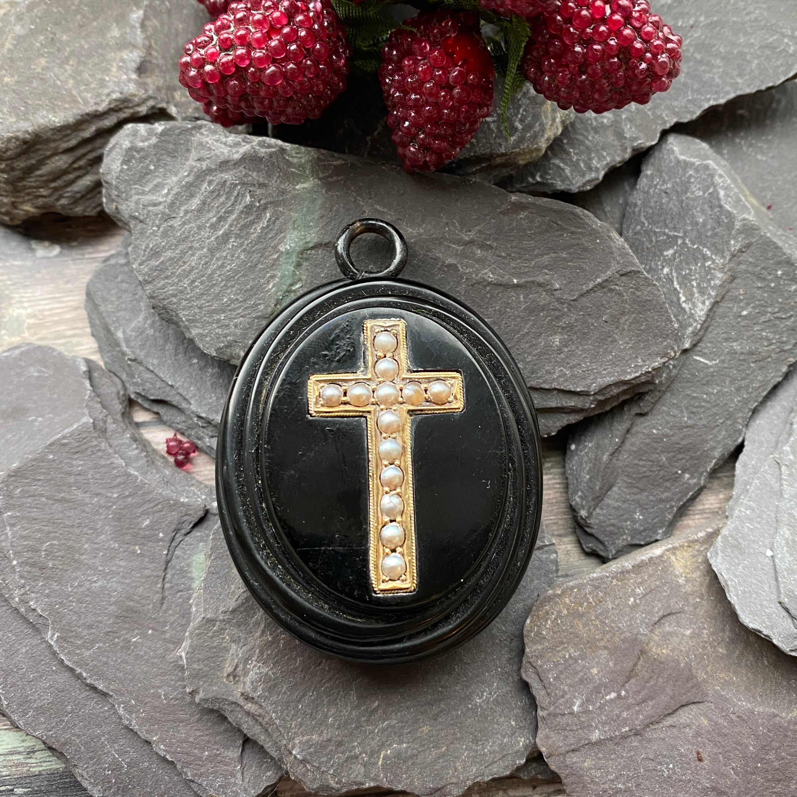 Victorian Whitby Jet mourning Locket with gold pearl detail.
