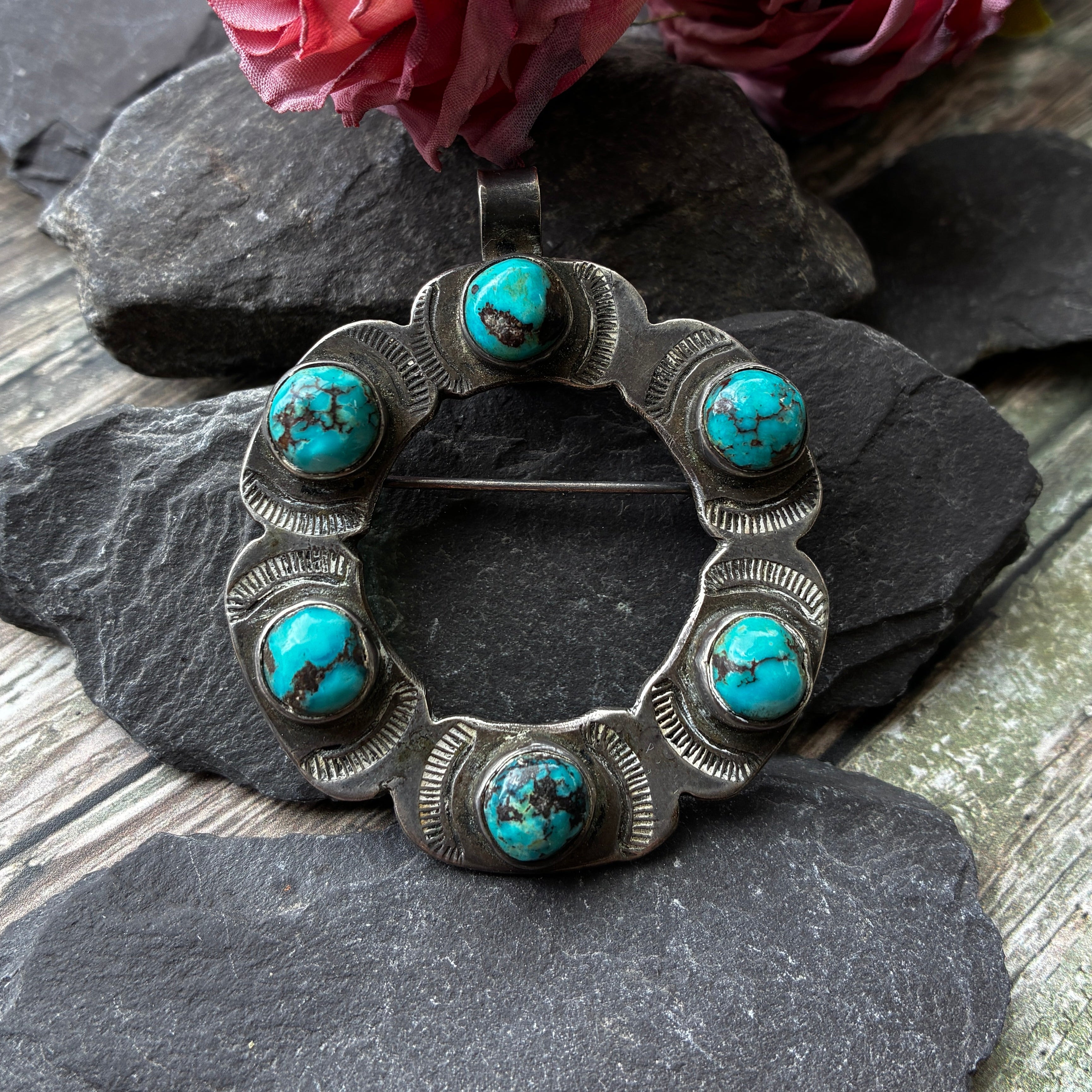 Antique Navajo pendant and brooch set with Turquoise stones.