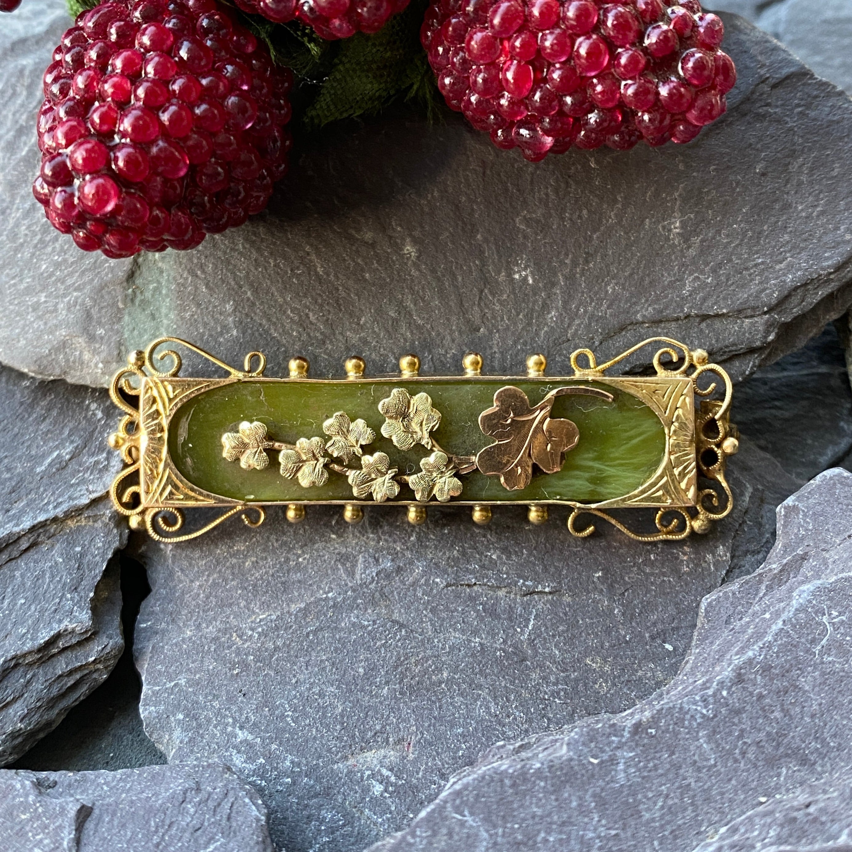 Edwardian 15ct gold brooch set with Connemara marble and gold sharocks.
