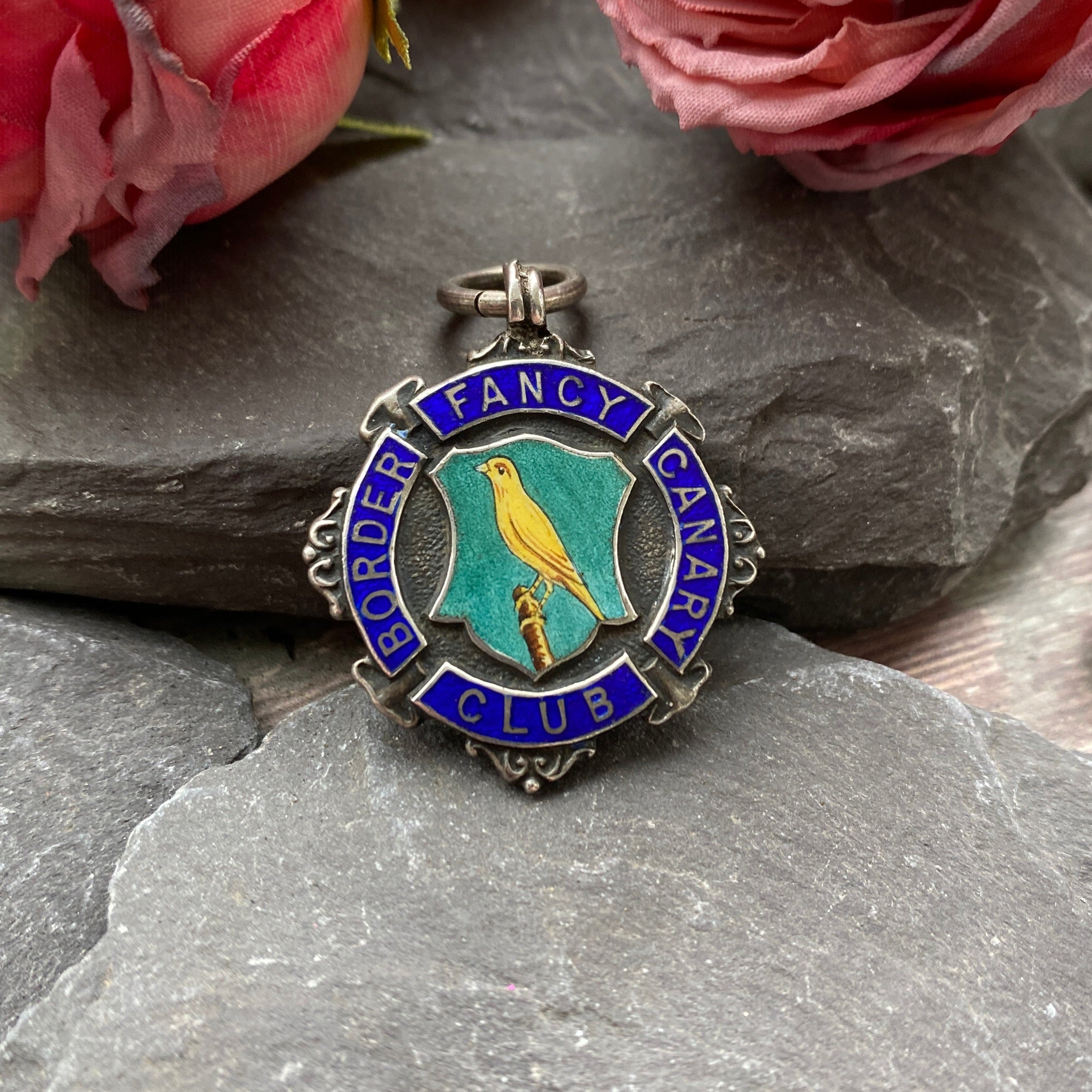 Early 20th c silver fob medal with enamel 'Canary club' award.