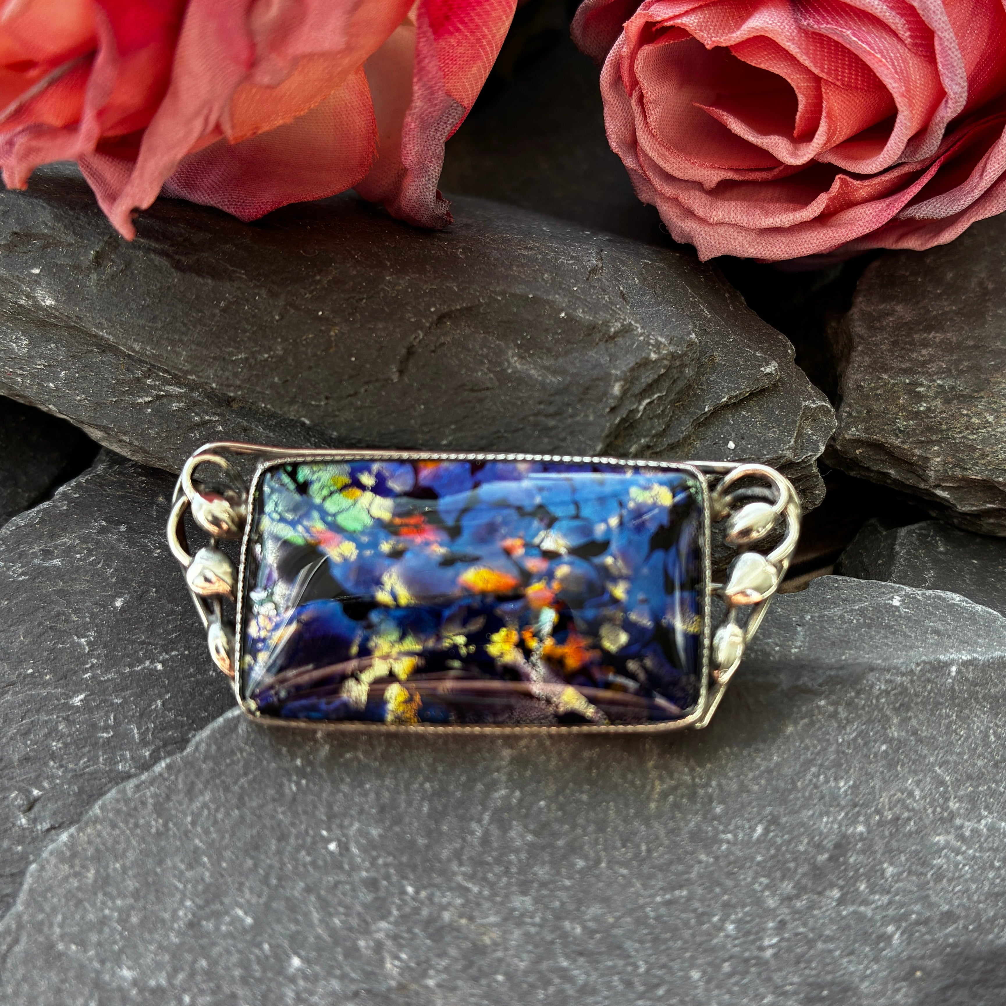 Art Nouveau silver and foil glass brooch.