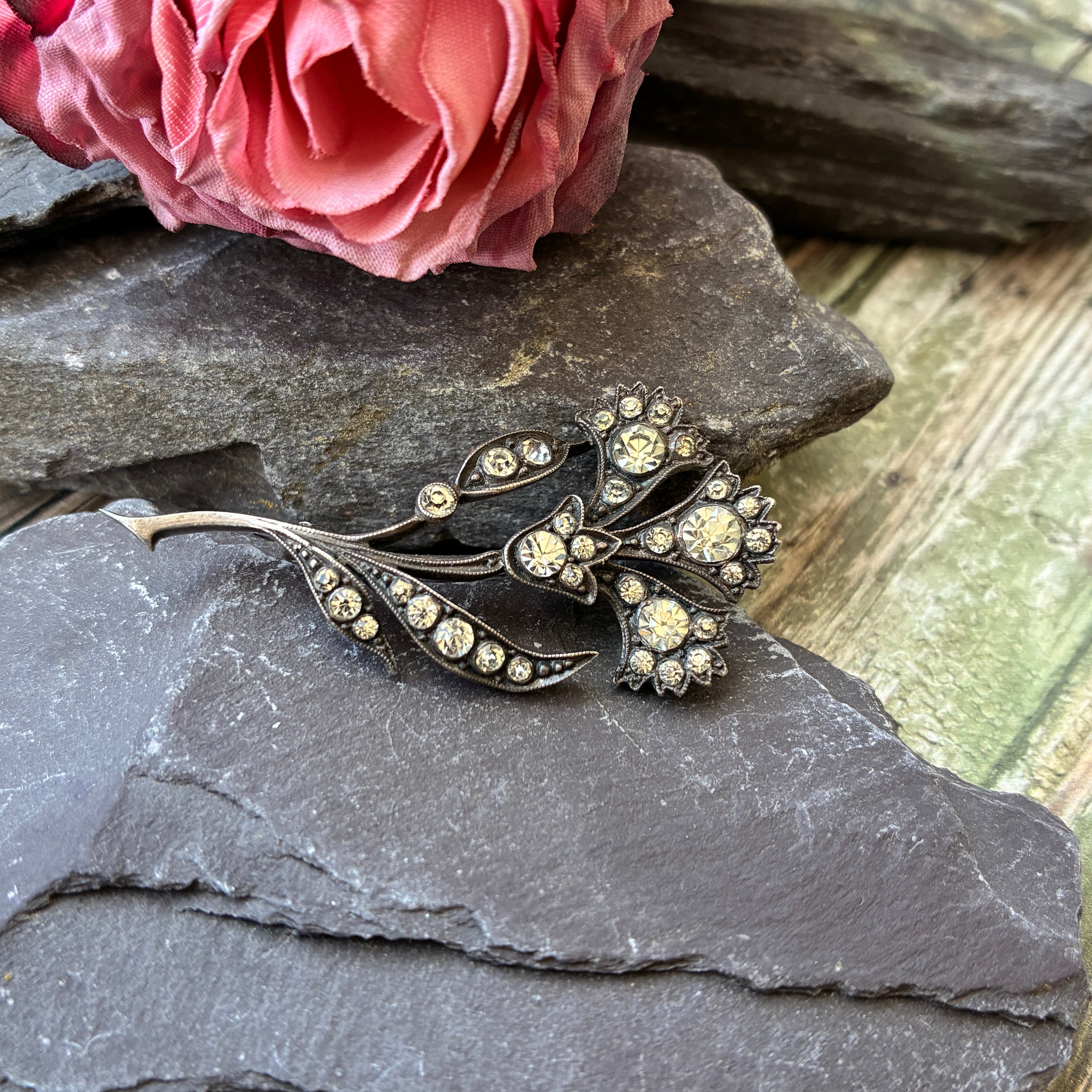 Vintage Knoll & Pregizer silver and paste floral spray brooch.