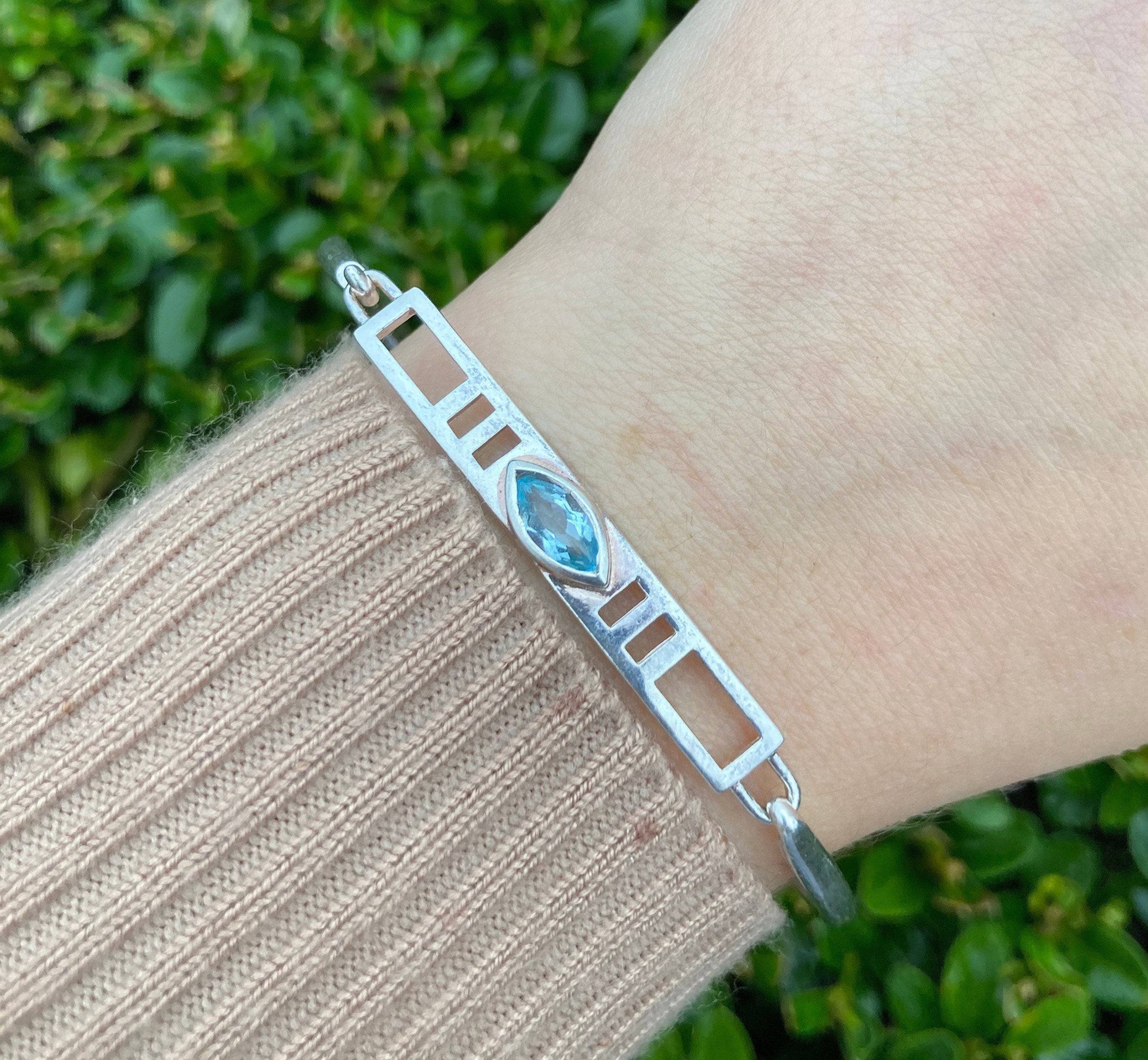 Sterling Silver & Blue Topaz Bangle.