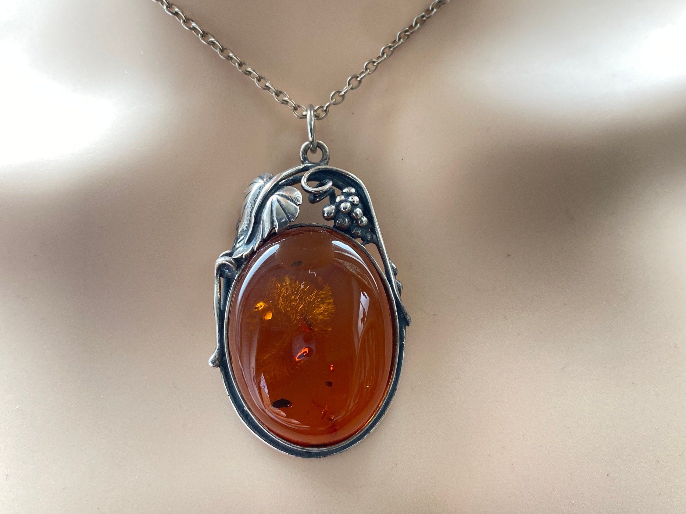 Sterling Silver Amber Pendant and 26" Chain.