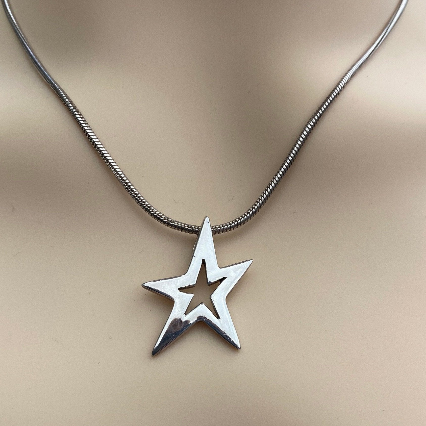 Silver Star Pendant Necklace With 17 inch Snake Link Chain.