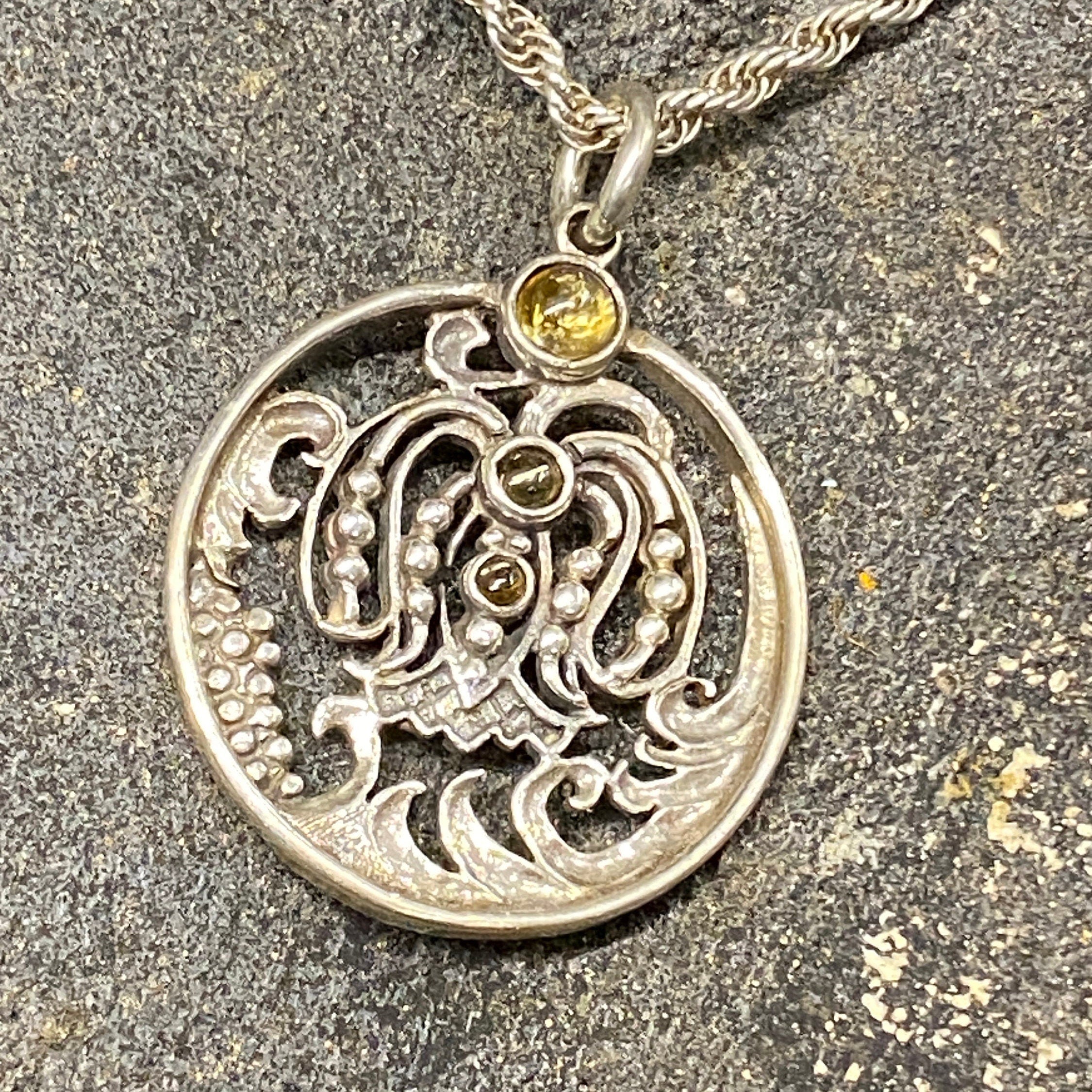 Oriental Design Pendant and 20" Chain in Sterling Silver With Yellow Paste Stones.